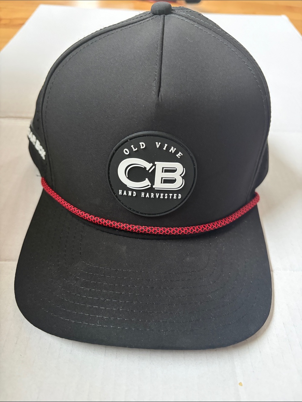 Black Baseball Cap with Red Rope Accent